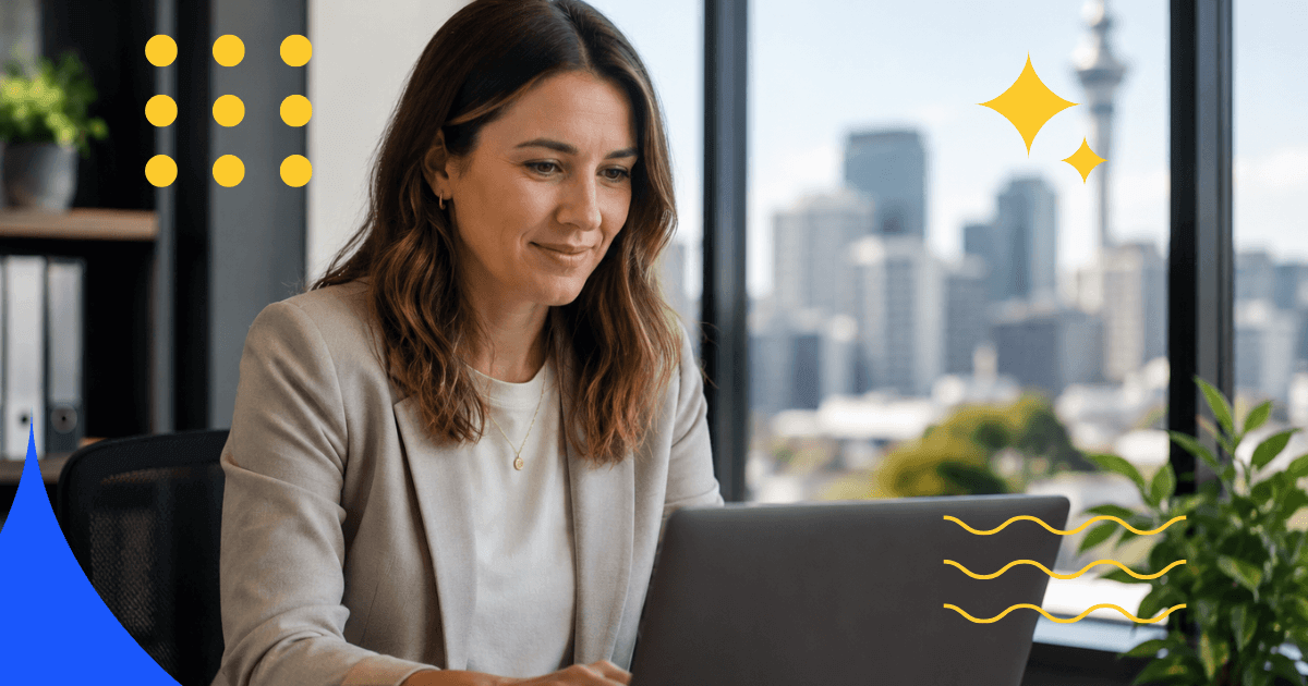 Woman working on a laptop with a city view behind her
